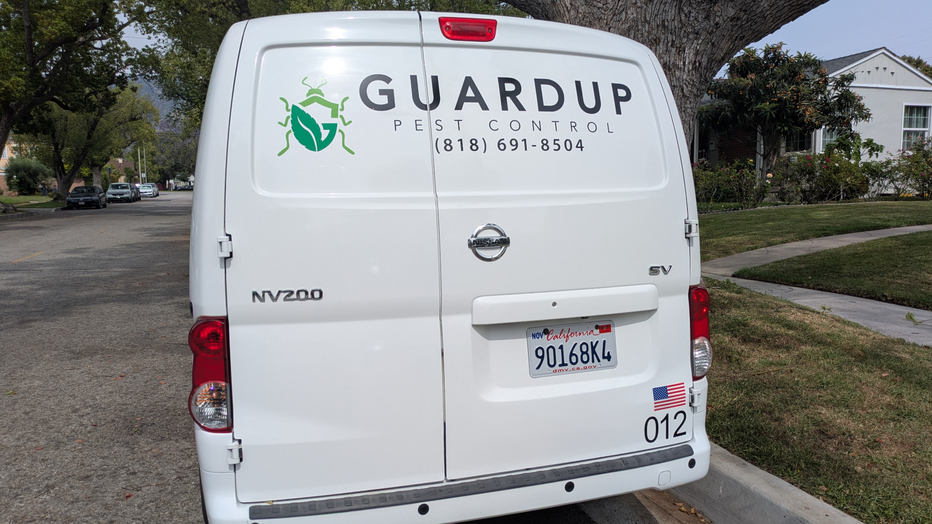 GuardUp Pest Control van rear graphics